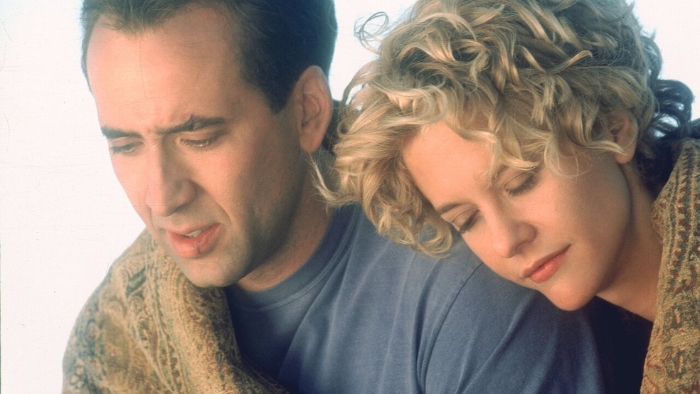 O longa-metragem Cidade dos Anjos é protagonizado pelos atores Nicolas Cage e Meg Ryan — Foto: Reprodução/IMDb
